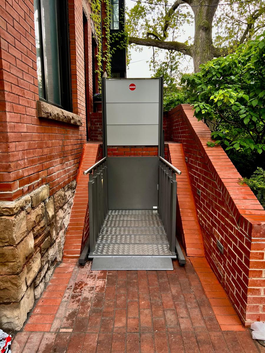 VPL on heritage brick exterior — platform level